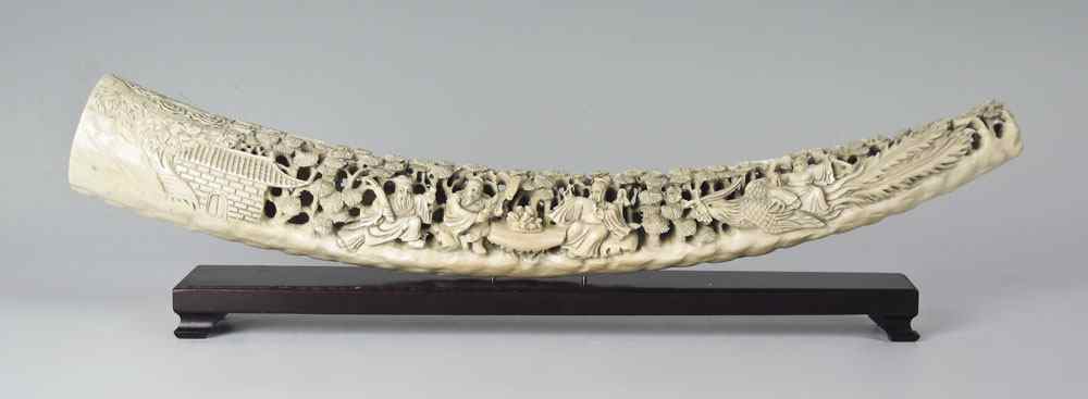 Appraisal: CARVED IVORY TUSK Highly detailed carved ivory tusk depicting Wise