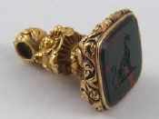 Appraisal: A fine antique gold and bloodstone seal with engraved crest