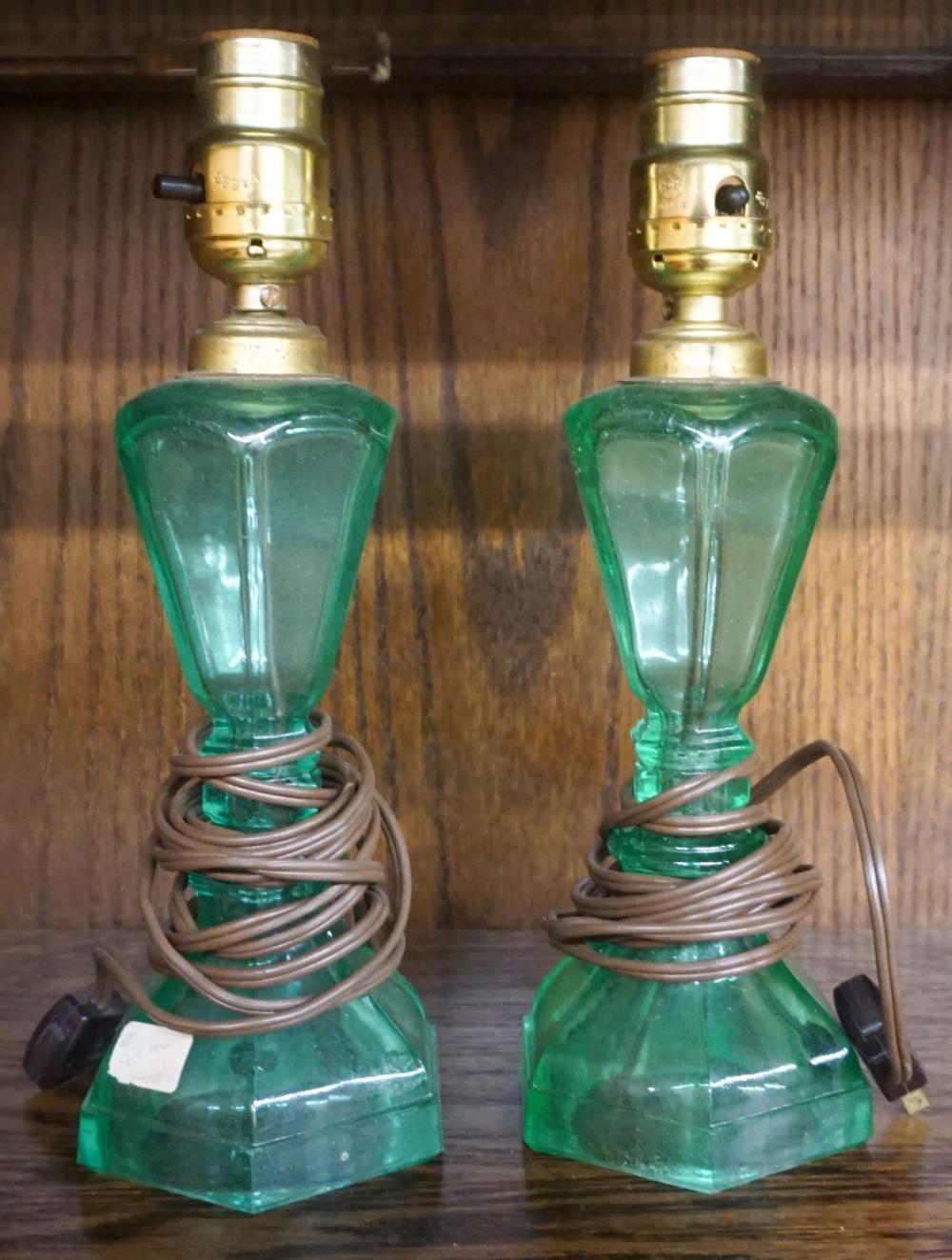 Appraisal: Pair Green Sandwich Glass Type Oil Lamps H in cm