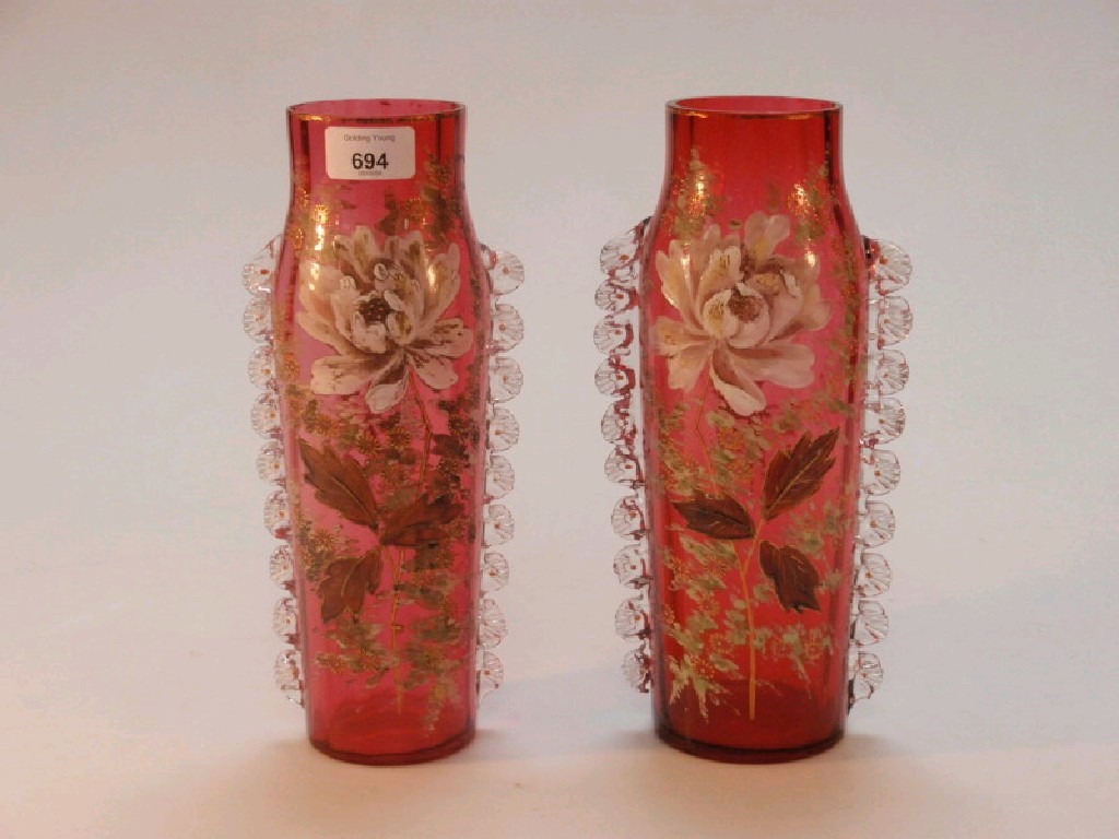 Appraisal: A pair of Victorian cranberry glass vases each with pinched