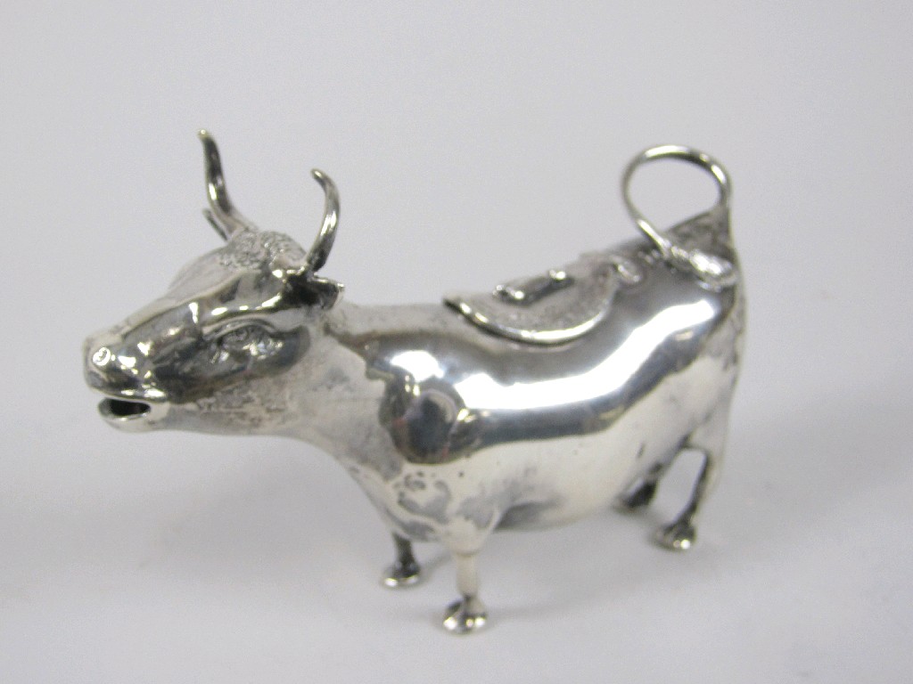 Appraisal: A Victorian Continental Cow Creamer with horns curled tail to