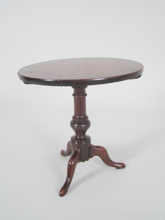 Appraisal: An th Century mahogany apprentice Pillar Table with knopped turned