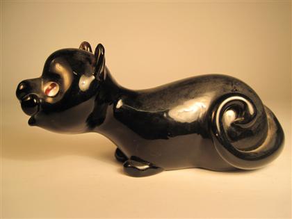 Appraisal: Black glass cat modelHand blown recumbent with insert eyes