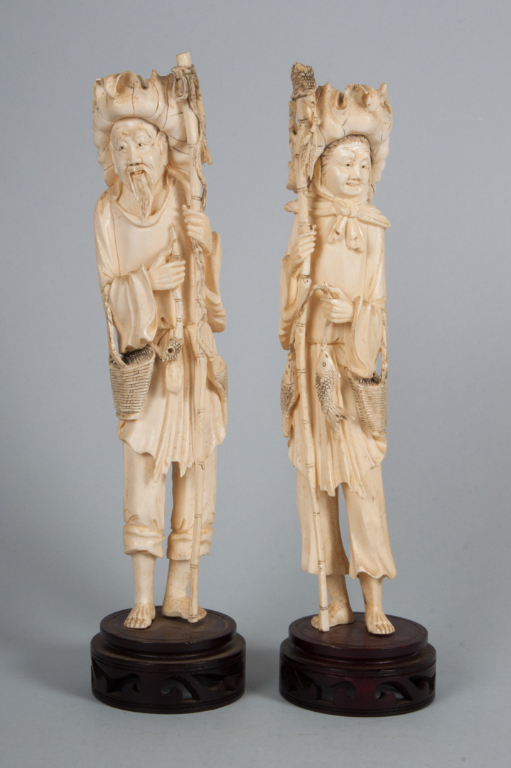 Appraisal: Pair of Japanese carved ivory fisherman male and female figures