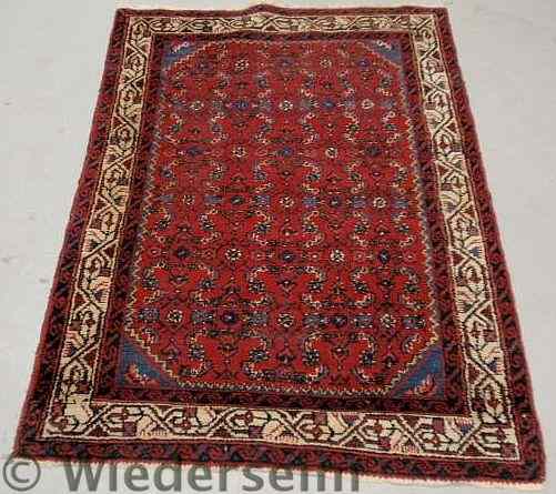 Appraisal: Persian mat with a red field ivory border and blue