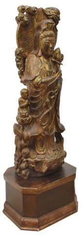 Appraisal: Buddhist figural carving Guanyin holding lotus blossom and prayer beads