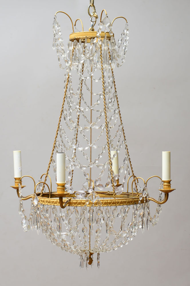 Appraisal: EMPIRE STYLE CUT-GLASS AND GILT-METAL FOUR-LIGHT CHANDELIER The main annulus