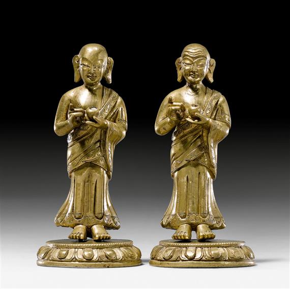 Appraisal: ANANDA AND KASYAPA Sino-Tibetan c H cm Bronze the eyes