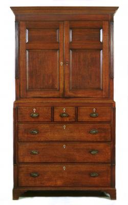 Appraisal: AN OAK CUPBOARD ON CHEST early th century with mahogany