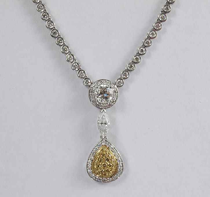 Appraisal: K GOLD DIAMOND CHAIN NECKLACE WITH YELLOW DIAMONDS DROP PENDANT