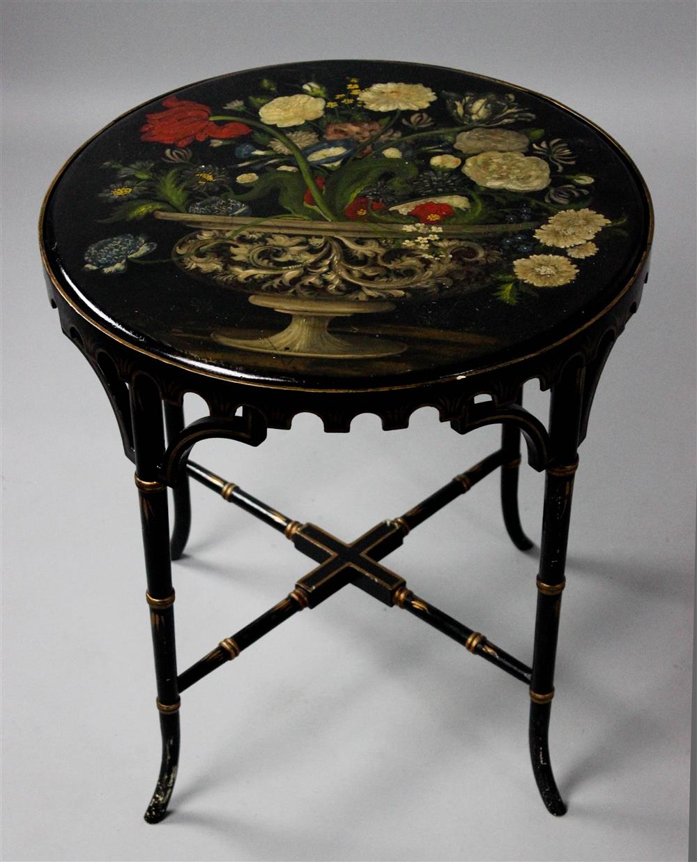 Appraisal: CIRCULAR EBONY AND SLATE POLYCHROME PAINT DECORATED TABLE the round