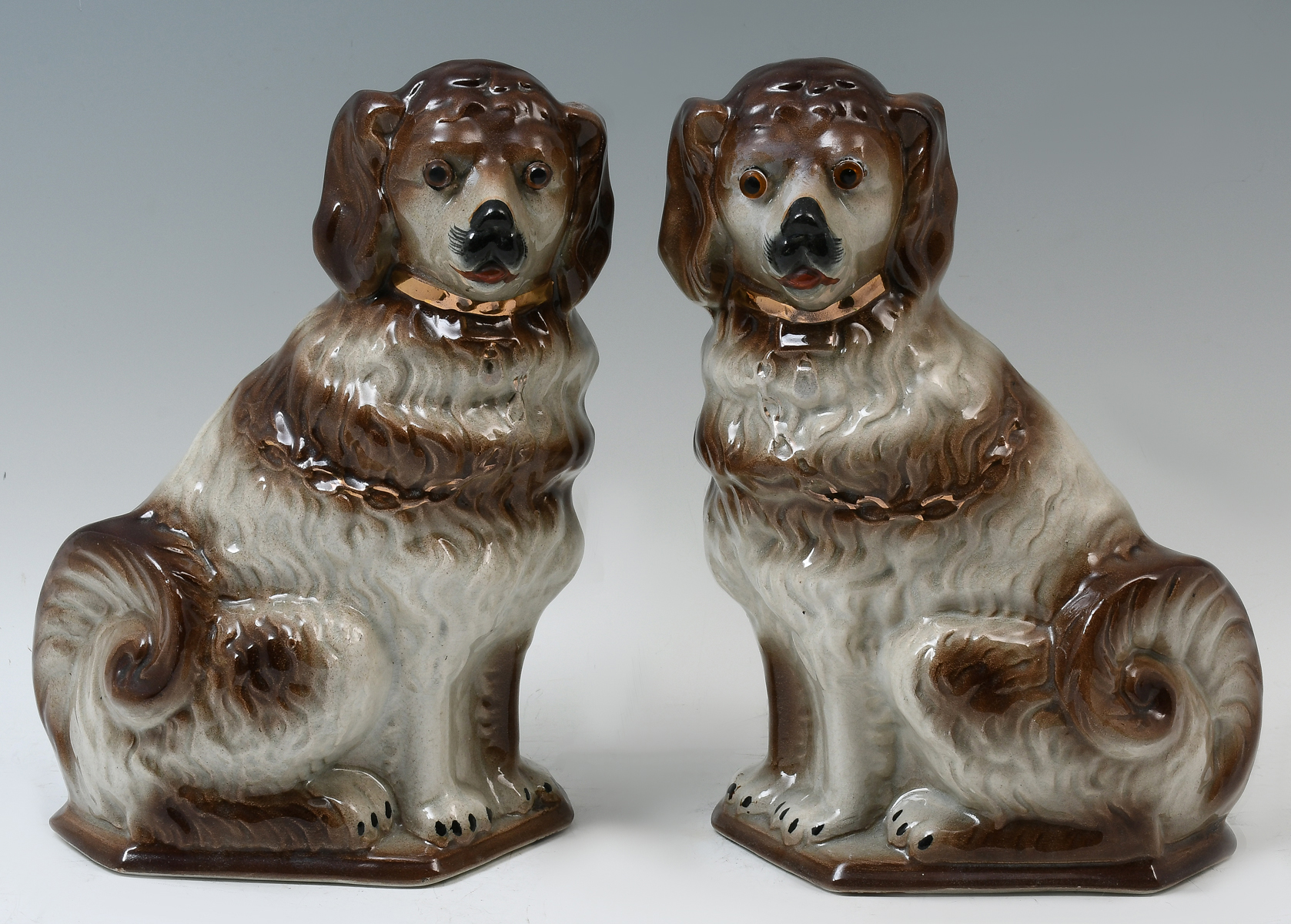 Appraisal: PAIR STAFFORDSHIRE PORCELAIN DOGS Pair of brown white Staffordshire dogs