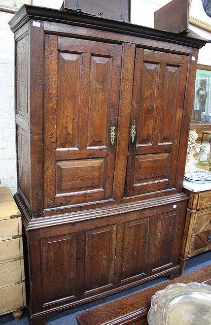 Appraisal: A TH CENTURY OAK PRESS CUPBOARD the upper section with