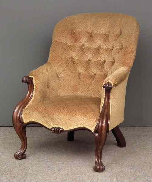 Appraisal: A Victorian mahogany framed spoon back easy chair upholstered in