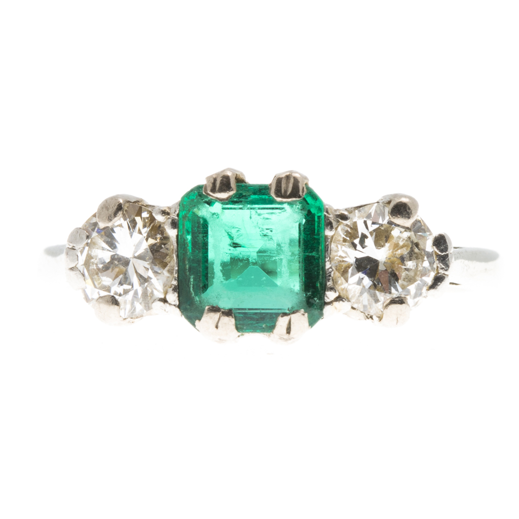 Appraisal: A three stone emerald and diamond set ring claw set