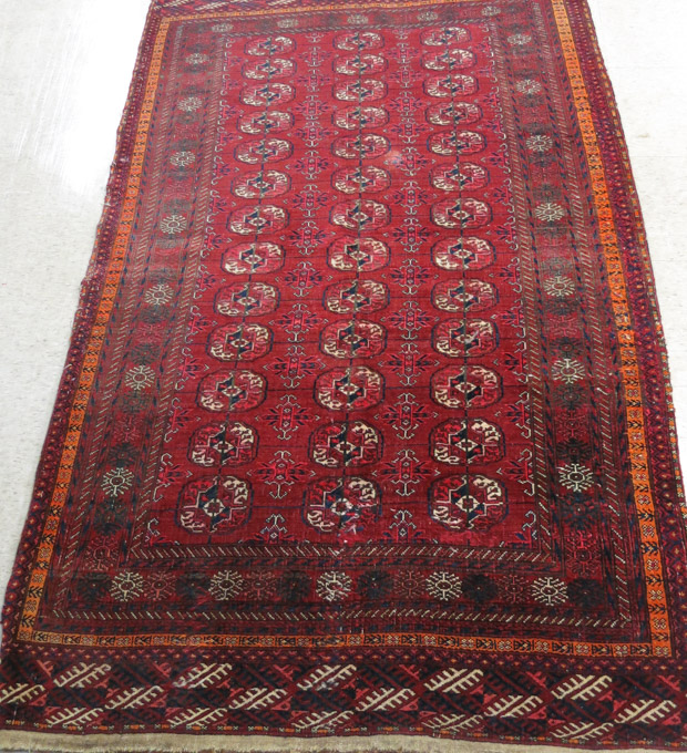 Appraisal: SEMI-ANTIQUE AFGHAN TEKKE AREA RUG featuring three columns of Turkoman