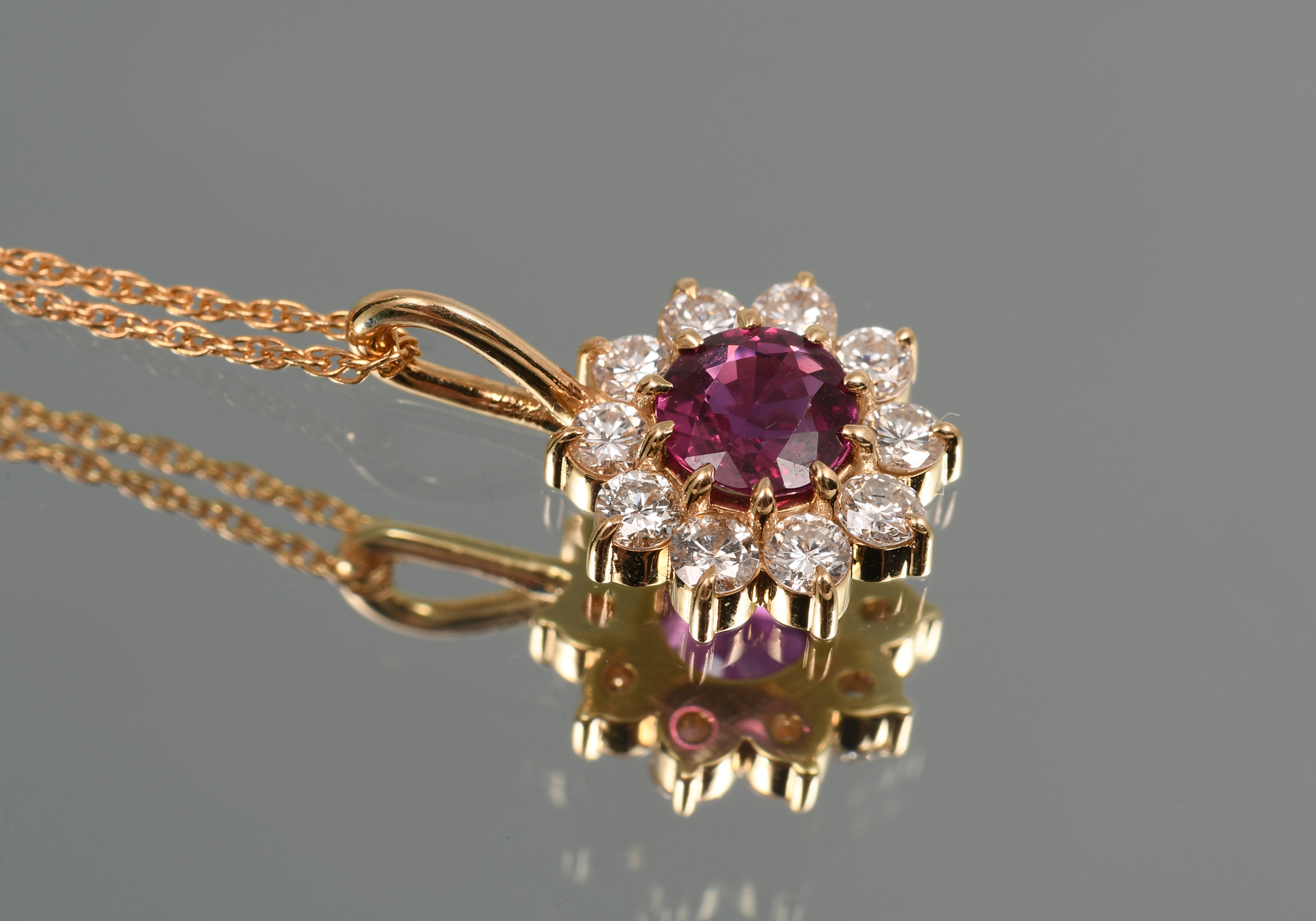 Appraisal: K RUBY DIAMOND PENDANT NECKLACE A single round mixed cut