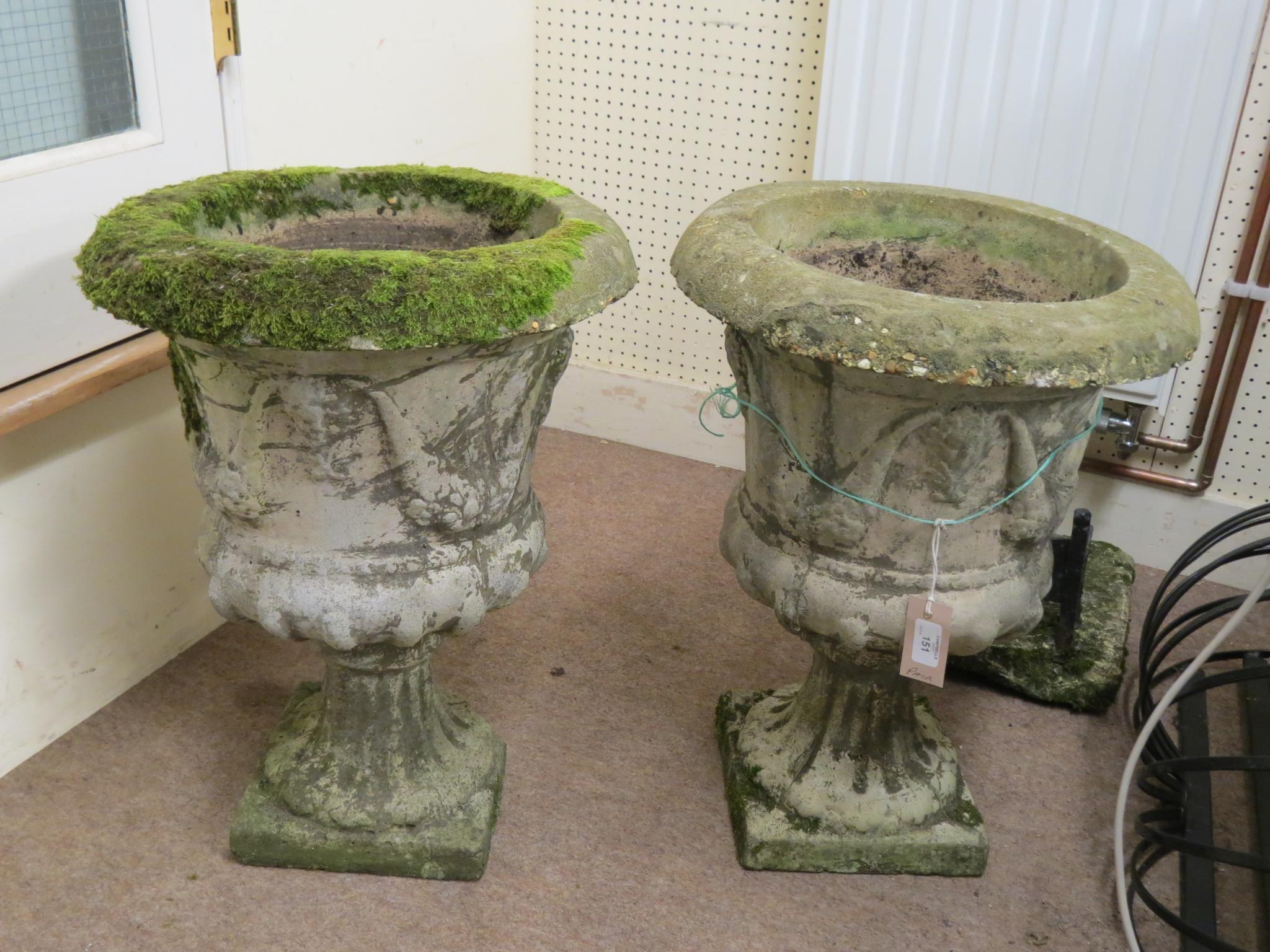 Appraisal: A pair of moulded concrete garden urns pedestal form with