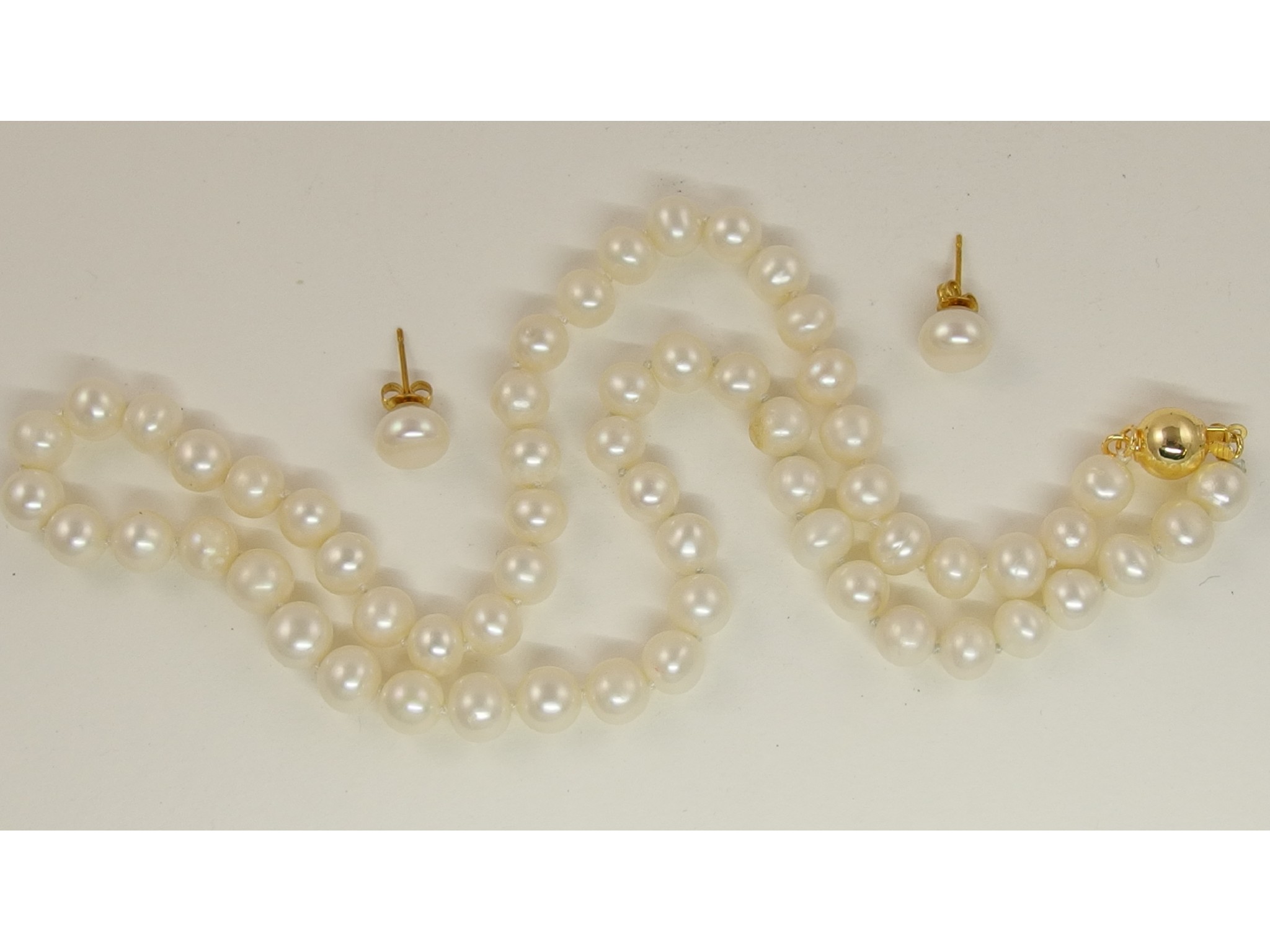 Appraisal: A white Akoya cultured pearl necklace and earring set