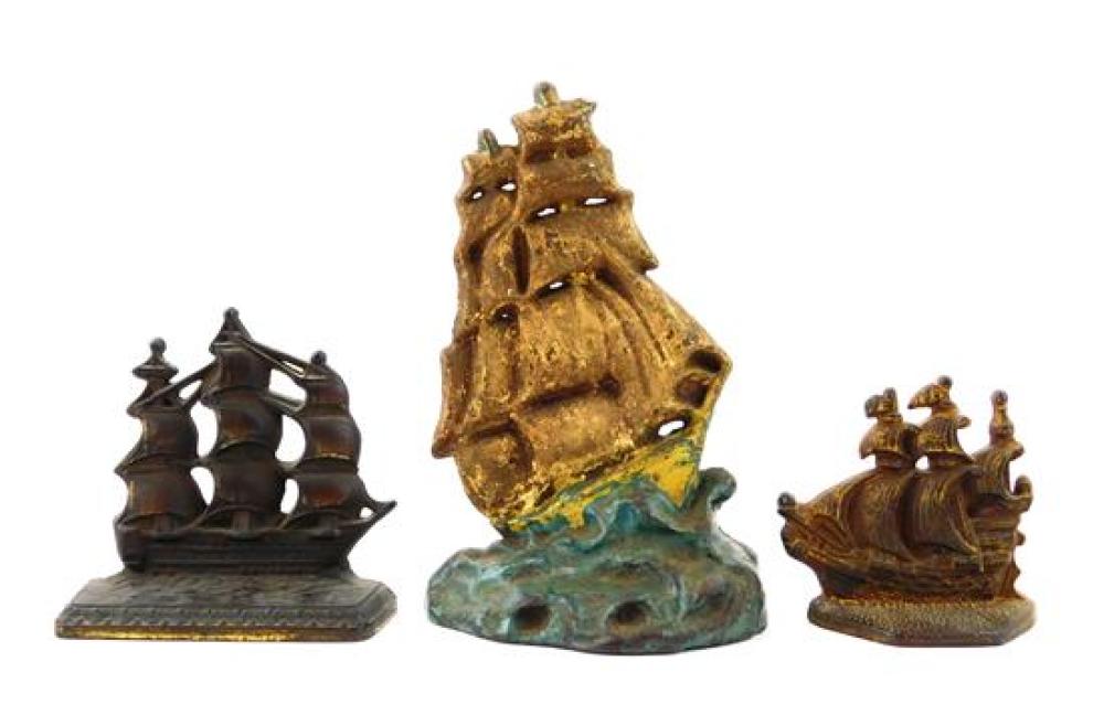 Appraisal: Three cast iron doorstops of sailing ships largest a clipper