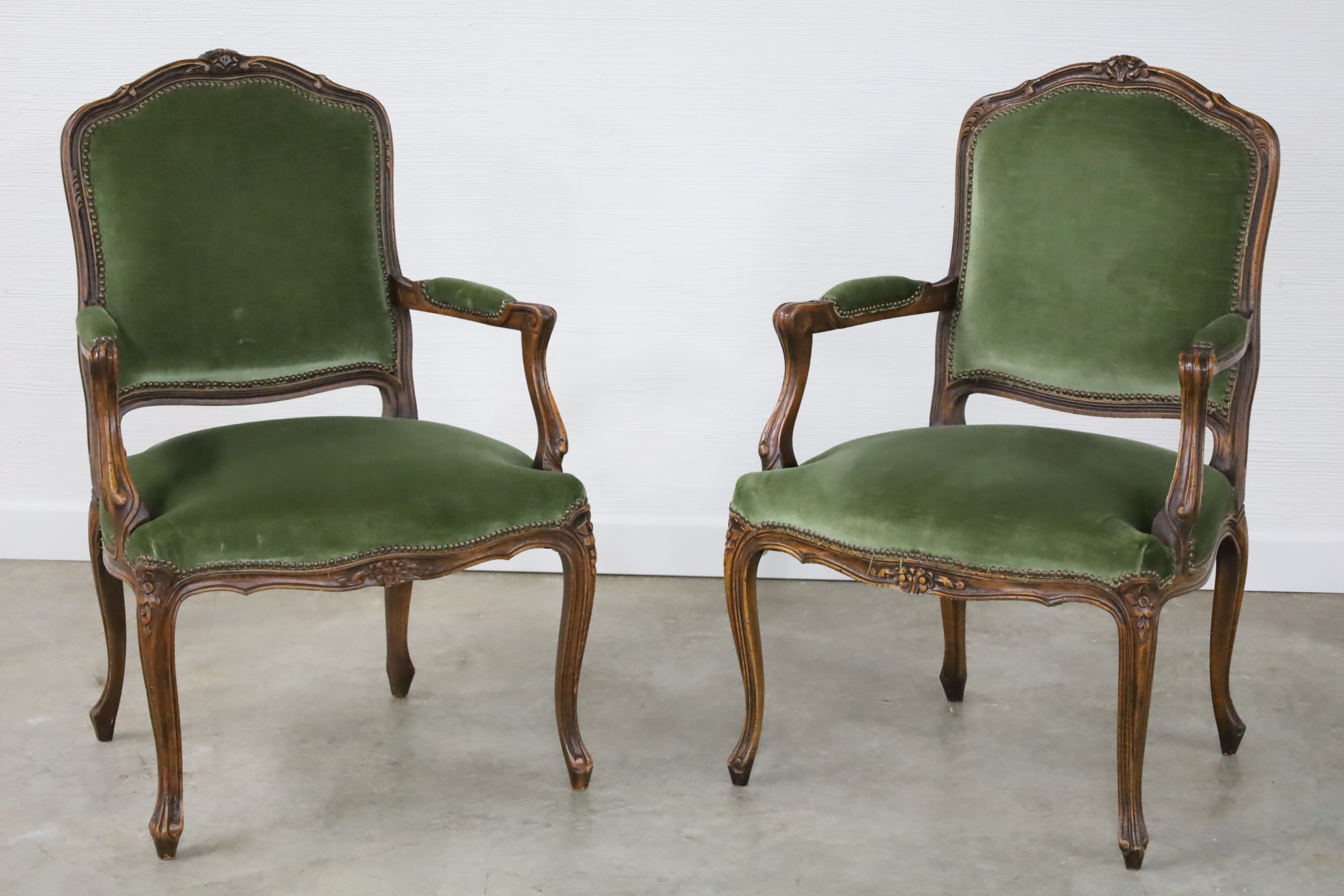 Appraisal: PAIR OF LOUIS XV STYLE CARVED WALNUT FAUTEUILS Pair of