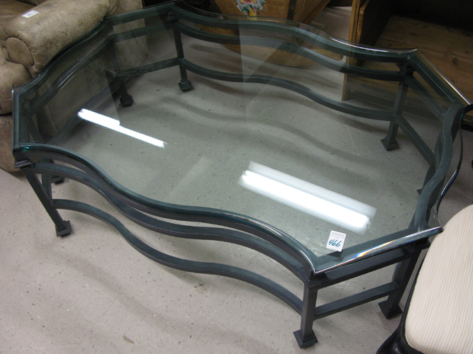 Appraisal: A LARGE COCKTAIL TABLE of metal construction with heavy clear