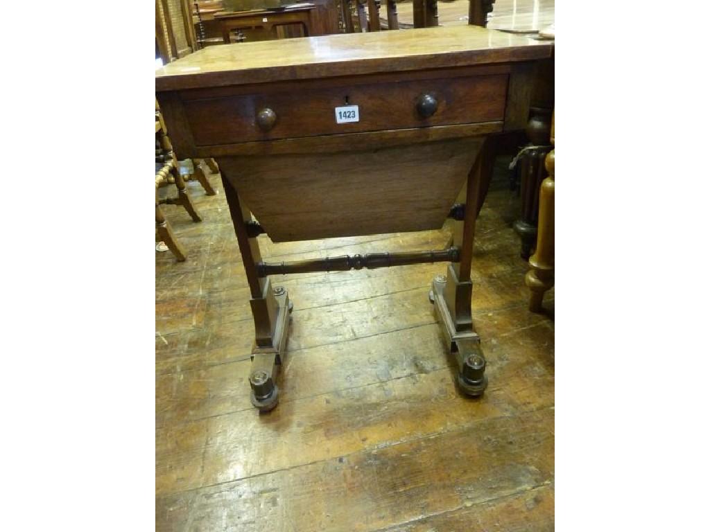 Appraisal: A Victorian rosewood sewing work table fitted with a shallow