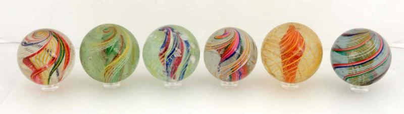 Appraisal: Includes one yellow and orange solid core marble one multi-color