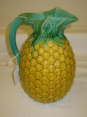 Appraisal: A MINTON MAJOLICA JUG modelled as a pineapple the rim