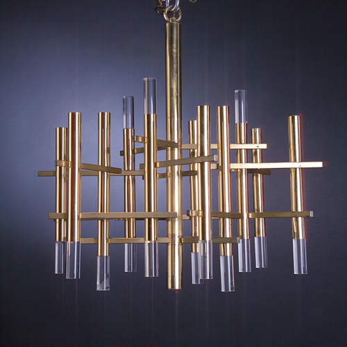 Appraisal: GAETANO SCIOLARI Polished brass chandelier with nine sockets and lucite