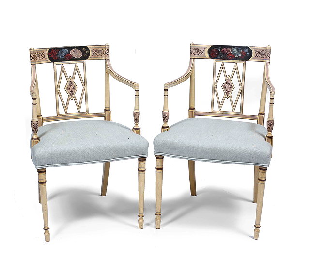 Appraisal: A PAIR OF GEORGIAN STYLE CREAM PAINTED CARVER ARMCHAIRS the