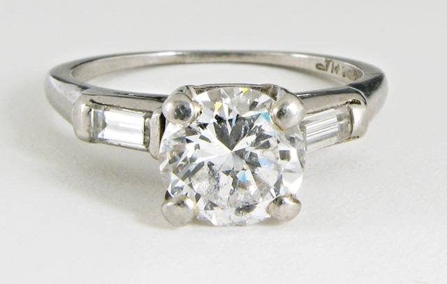 Appraisal: DIAMOND AND PLATINUM RING with appraisal The ring centers a