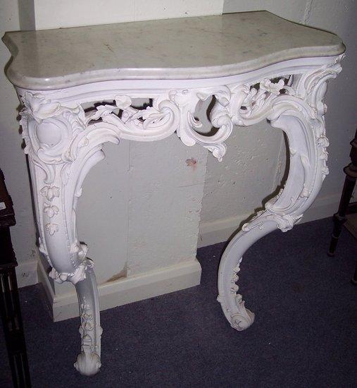 Appraisal: A marble top console table the white painted base pierced