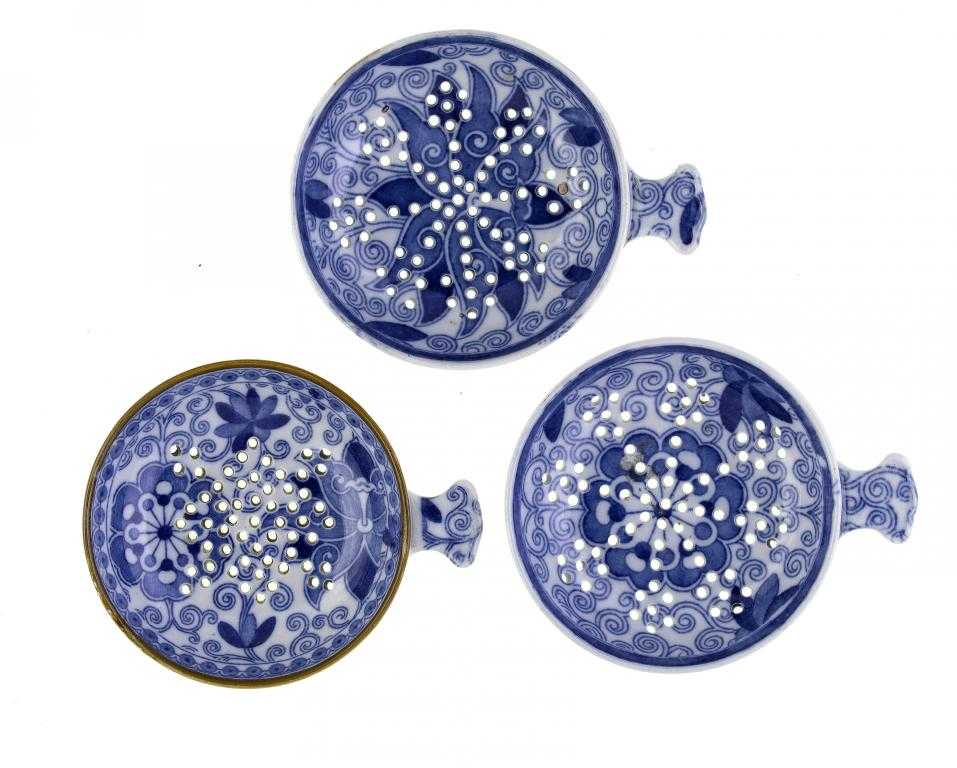 Appraisal: THREE BLUE PRINTED PEARLWARE TENDRIL PATTERN EGG DRAINERS ATTRIBUTED TO