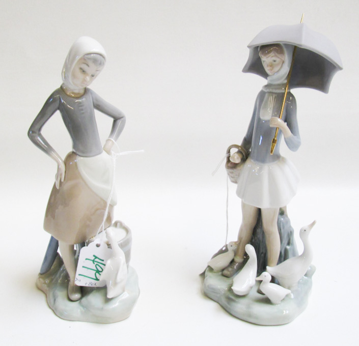 Appraisal: TWO LLADRO PORCELAIN FIGURINES issued Girl with Umbrella by sculptor