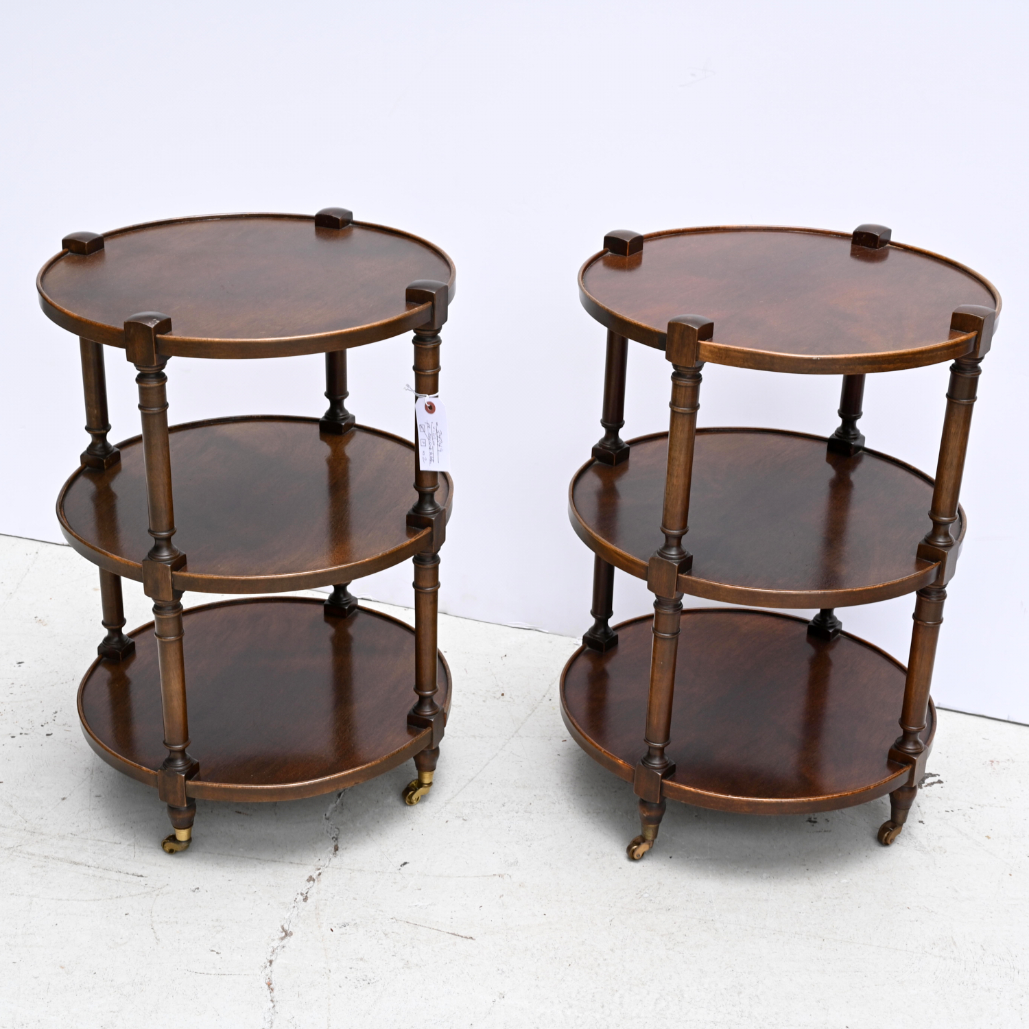 Appraisal: PAIR TRADITION HOUSE TIERED SIDE TABLES th c -tier round