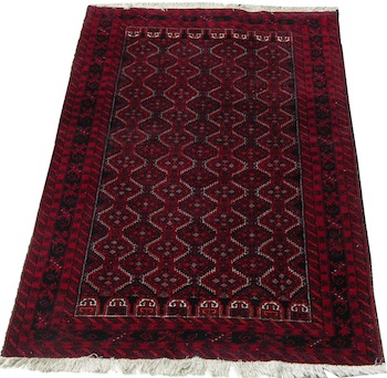 Appraisal: A Persian Carpet Red overall with geometric patterns details in