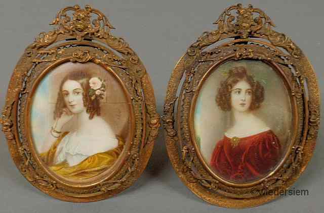 Appraisal: Two oval French miniature on ivory portraits of young women