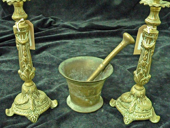 Appraisal: A pair of cast brass candlesticks cm high and a