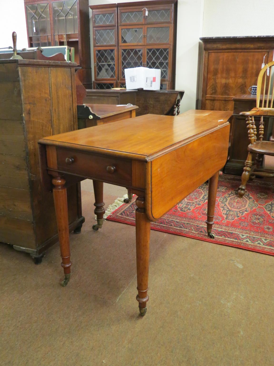 Appraisal: A Victorian mahogany Pembroke table single frieze drawer and opposing