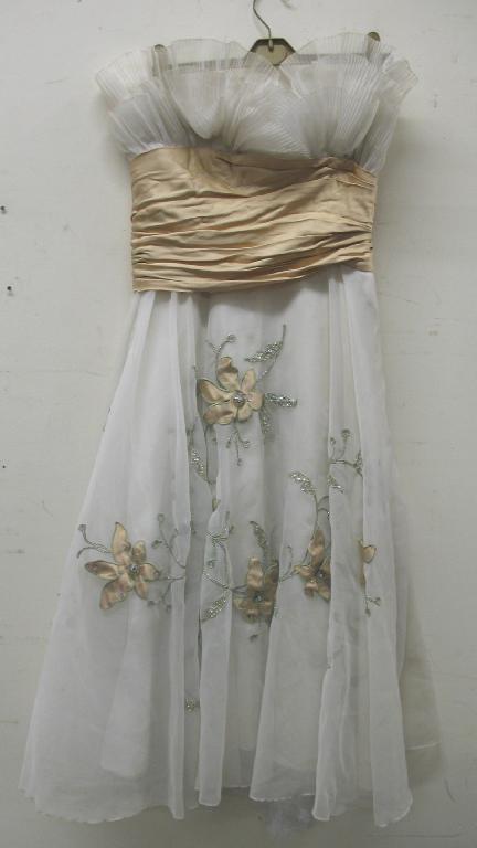 Appraisal: A short cream and gold satin evening dress the skirt