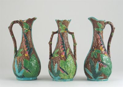 Appraisal: A set of two Majolica jugs and a matching vase