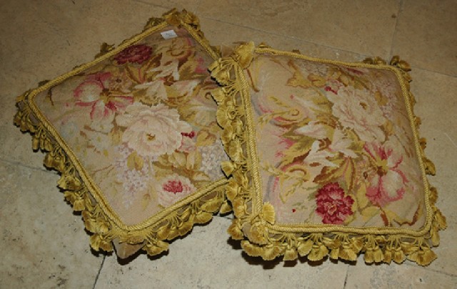 Appraisal: A GOOD PAIR OF FEATHER DOWN FILLED NEEDLEWORK CASED CUSHIONS