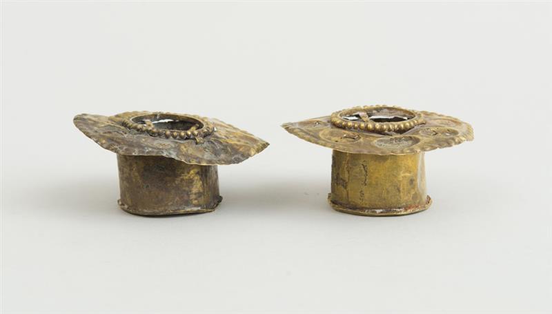 Appraisal: PAIR OF AFRICAN REPOUSS BRASS EARLOBE ADORNMENTS in diam Property