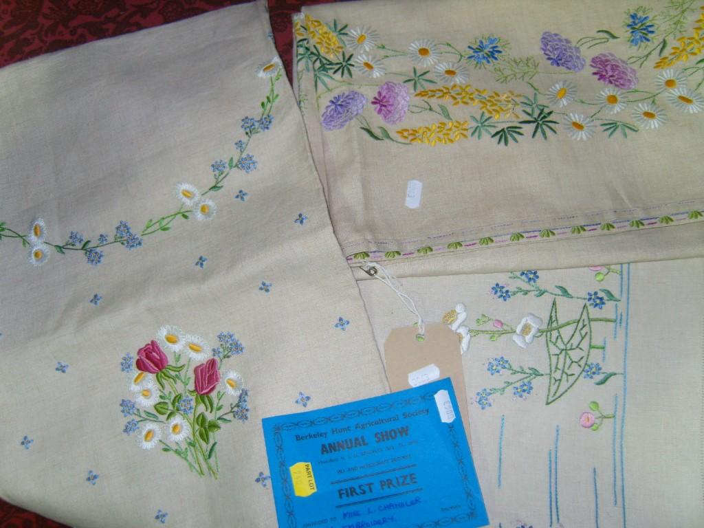 Appraisal: Four finely embroidered tablecloths with floral decoration together with a