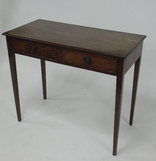 Appraisal: A rectangular mahogany side table fitted two drawers to the