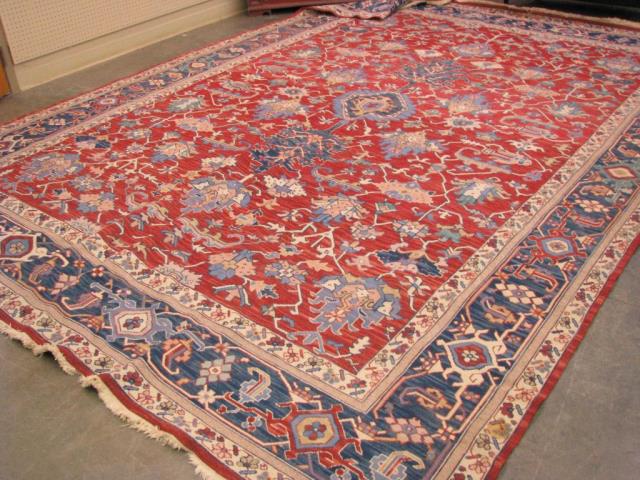 Appraisal: A vintage room-size Oriental rug ' x ' red field