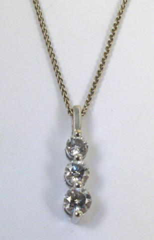 Appraisal: DIAMOND AND WHITE GOLD PENDANT NECKLACE the three stone diamond