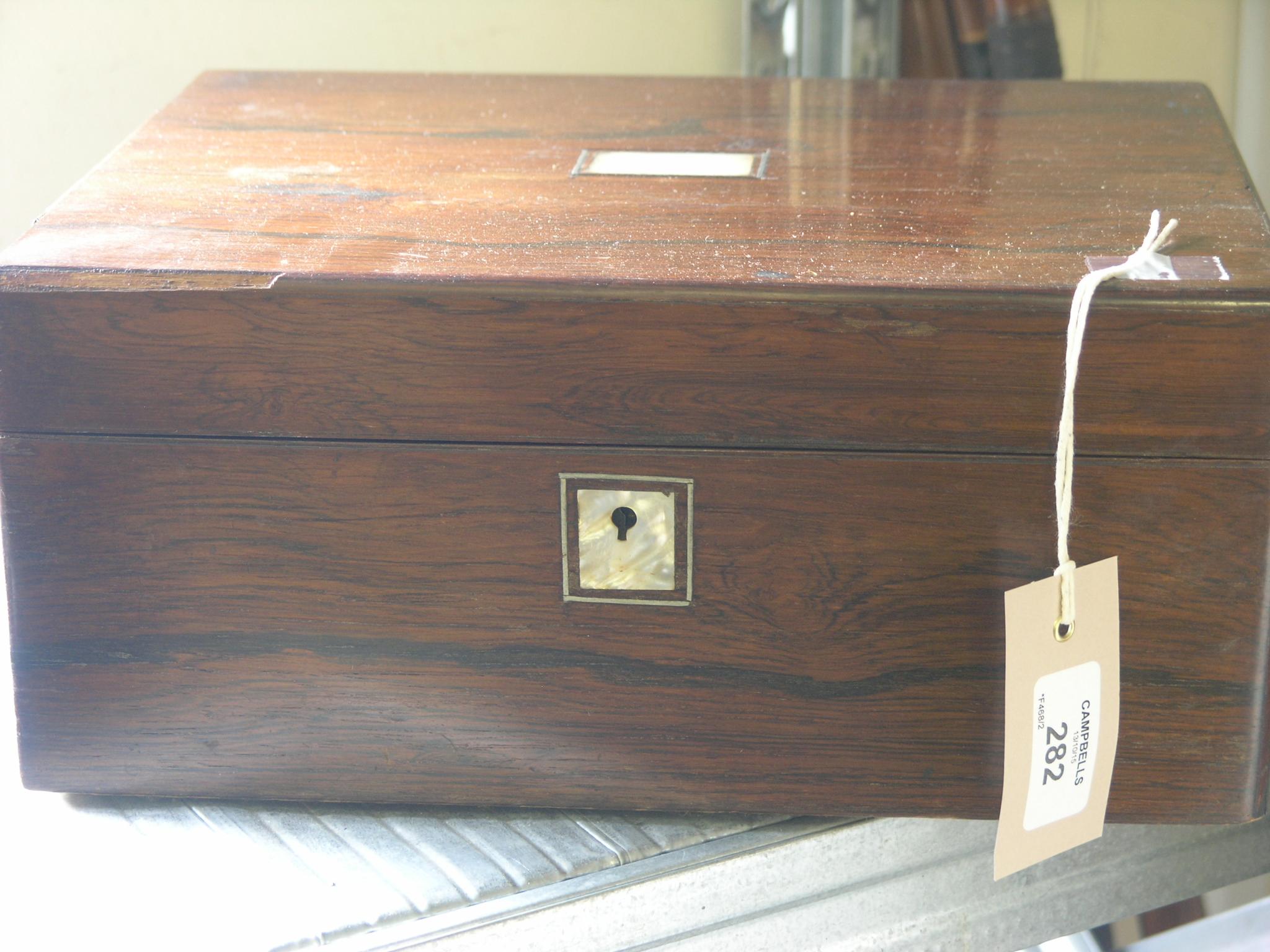 Appraisal: A Victorian rosewood box with inset mother of pearl in