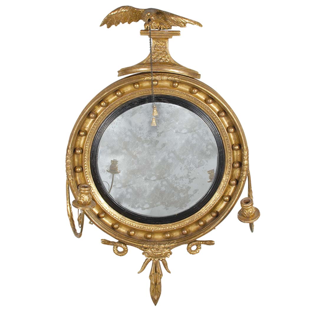 Appraisal: Regency Part Ebonized Gilt-Wood Convex Mirror Circa The circular mirror